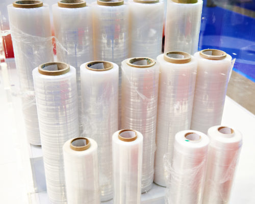 Reels of packing polyethylene film in the store